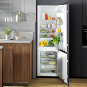Kitchen view with open fridge