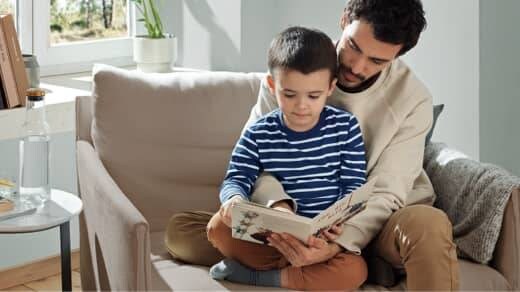 Man reading to boy